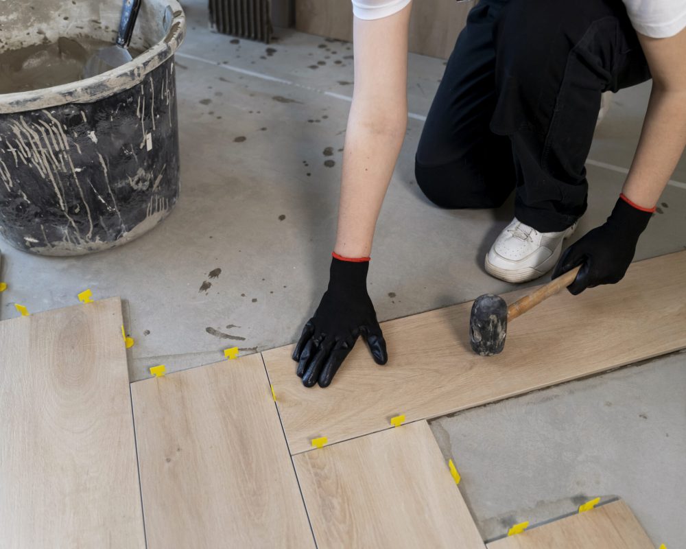 high-angle-worker-tiling-floor